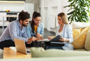 agent talking with couple about return of premium life insurance